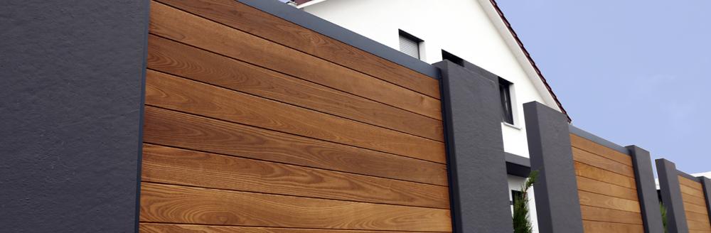 modern composite fencing in front of a house