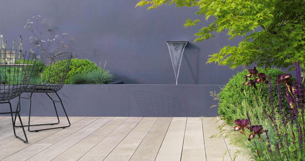 garden seating in a modern garden decked with composite boards