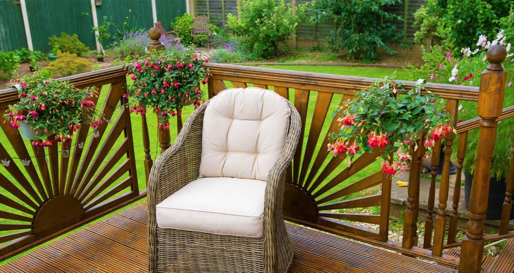 wooden garden decking with sunburst privacy fence screens