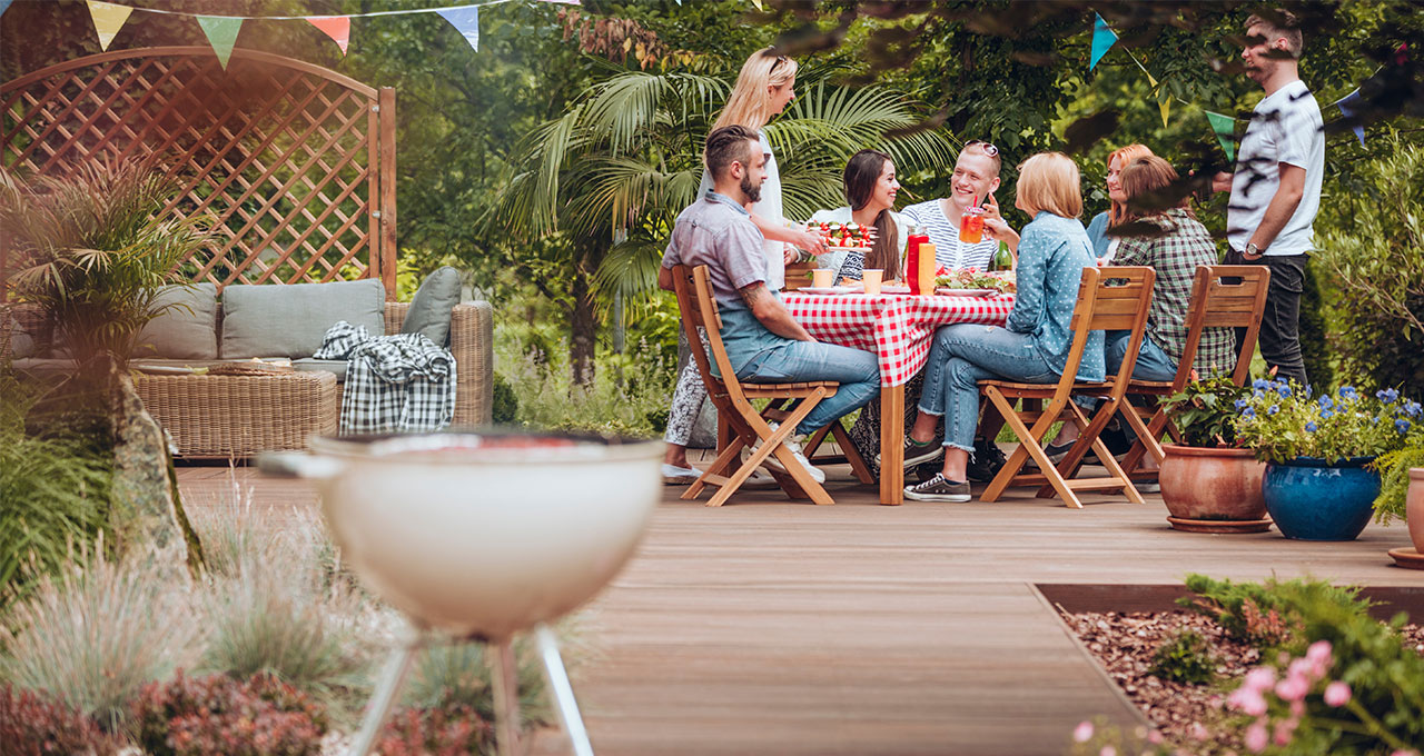 family enjoying a decked area for garden bar