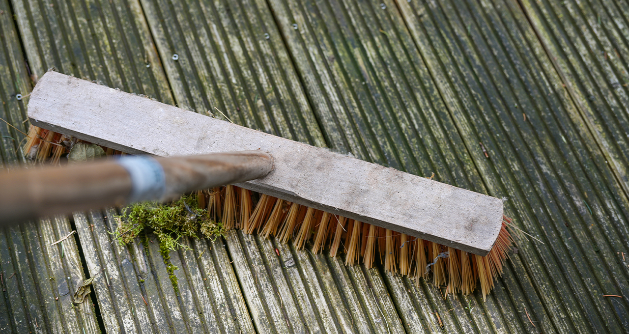 how to look after decking with a broom